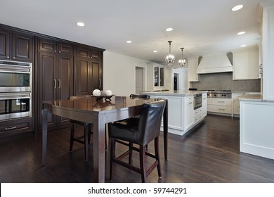 Kitchen In New Construction Home With Dark Wood Cabinetry