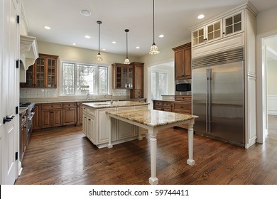 Kitchen In New Construction Home With Wood Cabinetry