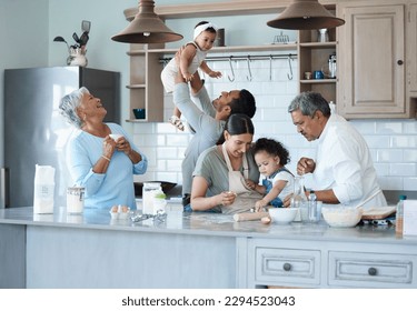 The kitchen is our happy place. Shot of a multigenerational family baking together in the kitchen. - Powered by Shutterstock