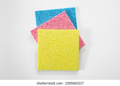 Kitchen Rags And Sponges On A White Background, Flat Lay.