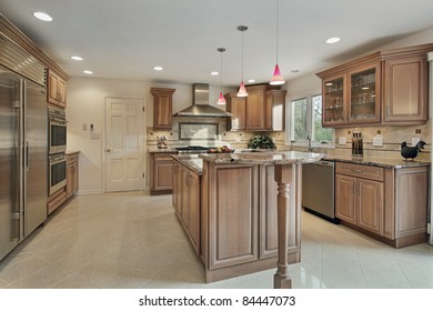 Kitchen In Remodeled Home With Wood Cabinetry