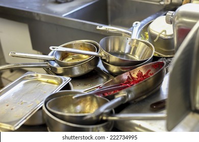 Kitchen In Restaurant, Sink Filled With Dirty Metal Dishes