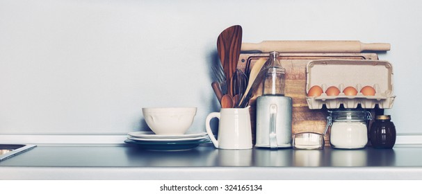 Kitchen Rustic Dishes, Table ware, Fresh Grocery and other Different Stuff on Grey Background. Toned Image with copy space