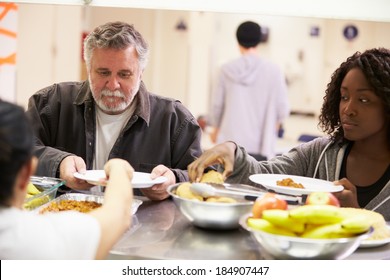 Kitchen Serving Food In Homeless Shelter