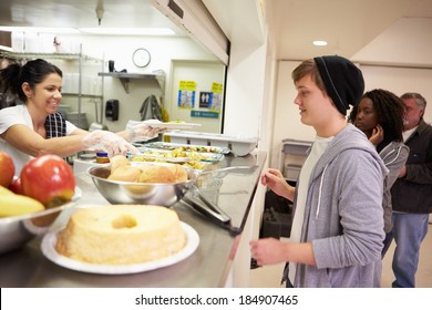 Kitchen Serving Food In Homeless Shelter