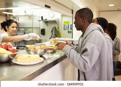 Kitchen Serving Food In Homeless Shelter