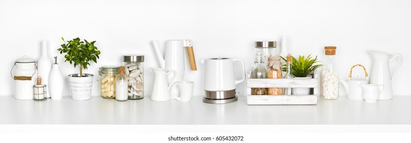 Kitchen shelf full of various utensils isolated on white background