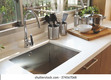 Kitchen sink and faucet - Shutterstock ID 374567068