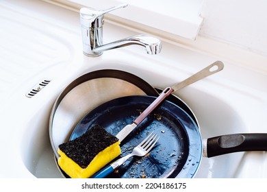 Kitchen Sink Filled With Dirty Dishes. Unwashed Dishes After Lunch Or Dinner In Sink, High Angle View. Concept Of Lack Of Time, Home Routine, Need For Dishwasher