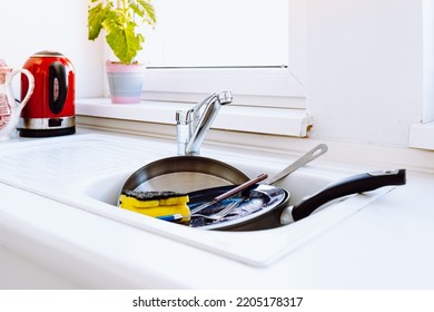 Kitchen Sink Filled With Dirty Dishes. Unwashed Dishes After Lunch Or Dinner In Sink, High Angle View. Concept Of Lack Of Time, Home Routine, Need For Dishwasher