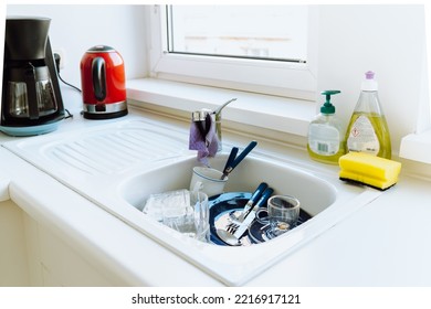 Kitchen Sink Is Filled With Dirty Dishes. Unwashed Dishes After Lunch Or Dinner In Sink, High Angle View. Concept Of Lack Of Time, Home Routine, Need For Dishwasher