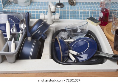 Kitchen Sink Full Of Dirty Dishes For Washing Up