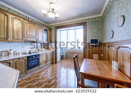 The kitchen is solid wood in a classic style in a modern house.