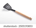 Kitchen spatula on isolated white background. Black silicone spatula with wooden handle. Cooking utensil