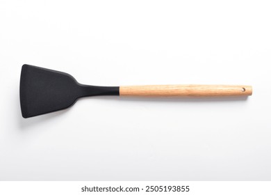 Kitchen spatula on isolated white background. Black silicone spatula with wooden handle. Cooking utensil - Powered by Shutterstock