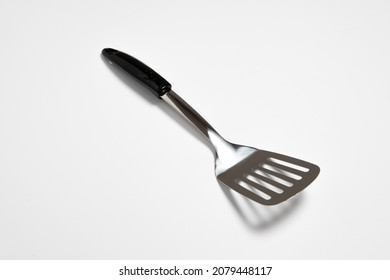 Kitchen Spatula Stainless steel isolated on white background.Slotted Spatula.High resolution photo.Top view.