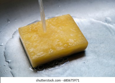 Kitchen Sponge Is Being Cleaned By Water