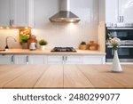 kitchen table background, wood counter top on blur of white clean abstract home interior with bokeh. used for display or montage your wooden for dining background.