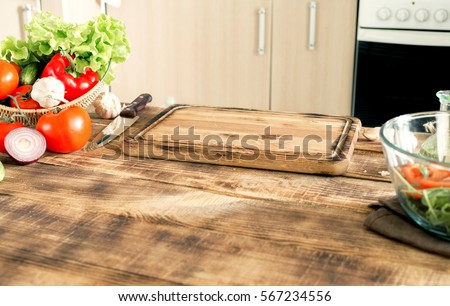 Kitchen table with the ingredients for cooking healthy food and a free place