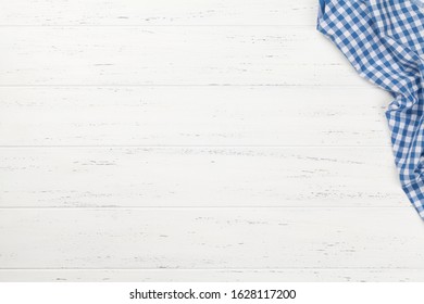 Kitchen table with tablecloth and space for your recipe or menu. Top view flat lay