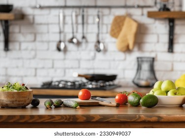 Kitchen table with various fresh food vegetables and fruit for healthy and diet eating with space for your product or text - Powered by Shutterstock