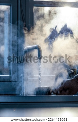 A kitchen tap delivers boiling water and steam.