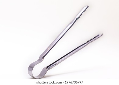 Kitchen tongs on white background - Shutterstock ID 1976736797