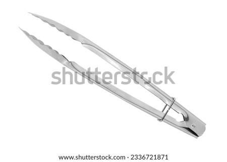 Kitchen tongs on a white background. Close-up metal kitchen tongs isolated on white background. Foto stock © 