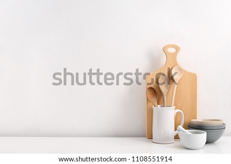 Kitchen utensils background with a blank space for a text, home kitchen decor concept, front view