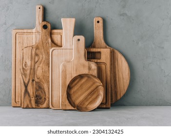 Kitchen utensils background with set of wooden cutting boards, copy space - Powered by Shutterstock