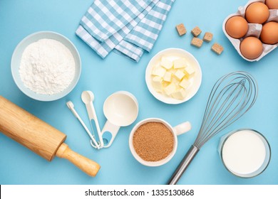 Kitchen Utensils And Baking Ingredients On Blue Background. Retro Style Baking And Cooking Flat Lay, Table Top View