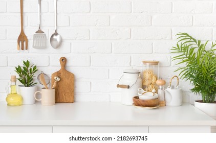 Kitchen utensils, cooking ingredients and kitchenware on white counter table - Shutterstock ID 2182693745