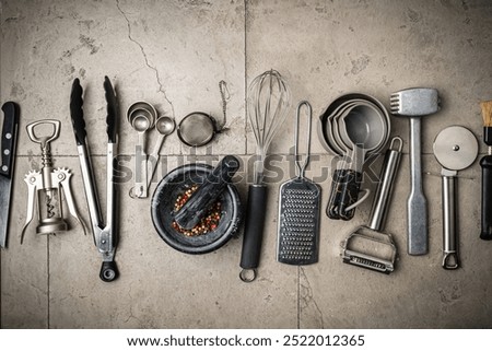 Kitchen utensils or cooking tools on gray background, top view, flat lay. Kitchenware collection with copy space. Cooking background.