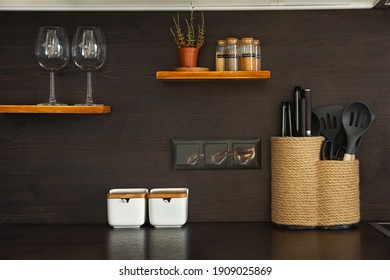 Kitchen Utensils, Decor, Jars With Spice, Knives. Glasses And Plant In A Modern Scandinavian Style Interior. Kitchen Objects On The Shelf And Table