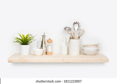 Kitchen Utensils, Flower Pot And Dishware On Natural Wooden Shelf