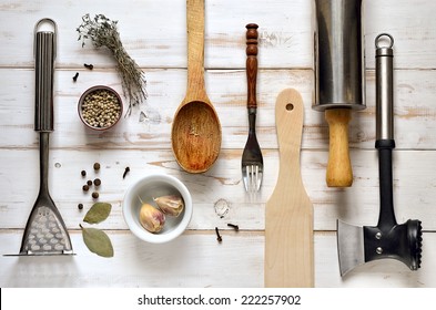 Kitchen Utensils On A Light Rustic Wooden Background