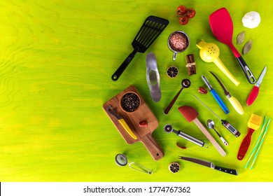 Kitchen utensils on a wooden background. Various kitchen utensils on wooden table. Chef tools. Home cooking.