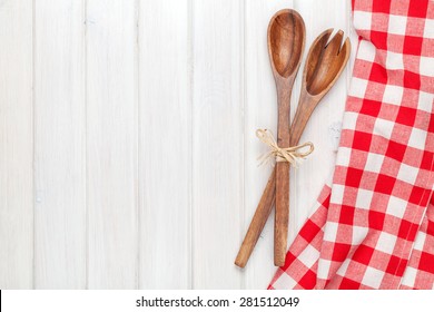 Kitchen Utensils Over White Wooden Table Background. View From Above With Copy Space