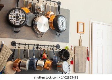 Kitchen wall rack for hanging pots, pans, aprons, and other utensils for efficient organization, storage and decor - Powered by Shutterstock