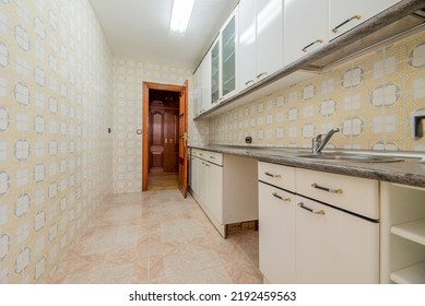 Kitchen With White Gloss Wood Cabinets, Gray Granite Countertops And Vintage Tiles