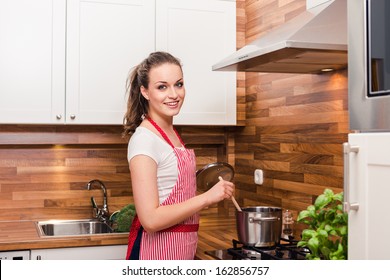 Kitchen Woman Making Healthy Food Standing Happy Smiling In Kitchen Preparing Salad