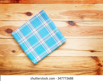 Kitchen. Wooden Kitchen Table With Empty Tablecloth For Dinner. View From Above With Copy Space