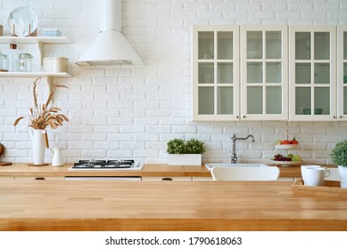 Kitchen wooden table top and kitchen blur background interior style scandinavian - Shutterstock ID 1790618063