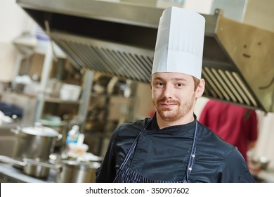 Kitchen Worker. Chef Cook Portrait In Restaurant During Food Preparation.