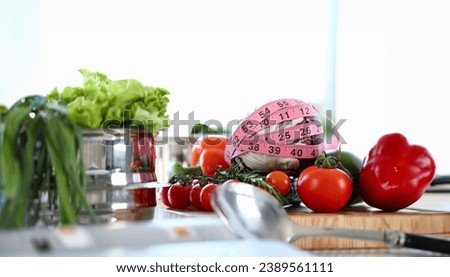 Kitchen Worktop Full Fresh Vegetable Abundance. Purple Cabbage Wrapped with Pink Centimetre. Organic Red Tomato Cherry on Table. Green Lettuce in Saucepan and Soup Ladle Horizontal Photography.