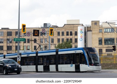 Kitchener, ON, Canada - September 16, 2022: A Waterloo Region, Grand River Transit Alstom, Formally Bombardier Streetcar Is Seen In Downtown Kitchener Passing By A Google Office In The Background.