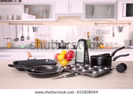 Kitchenware for cooking classes on wooden table
