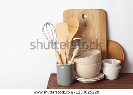 kitchenware on a wooden table on a light background. Cooking appliances.

