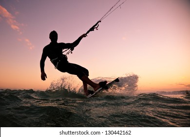 Kite boarding. Kitesurf freestyle at sunset.