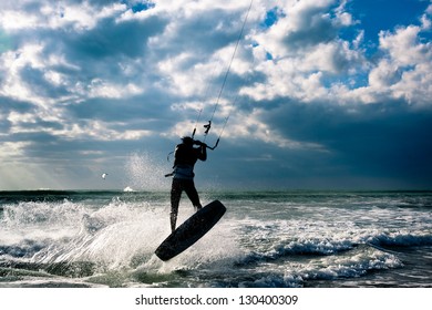 KITE BOARDING. Kite Surfer Jumping.